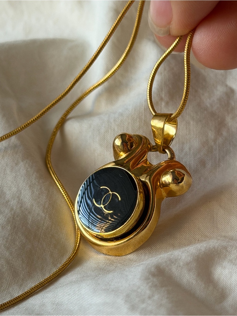 CHANEL Gold and Black CC Medallion Pendant Necklace